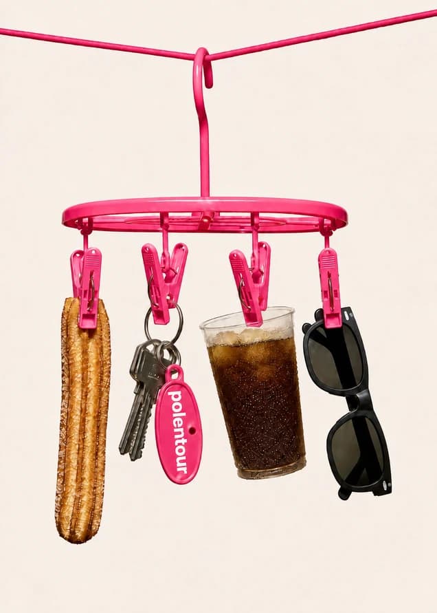 Everyday accessories hanging from a playful pink circular hanger