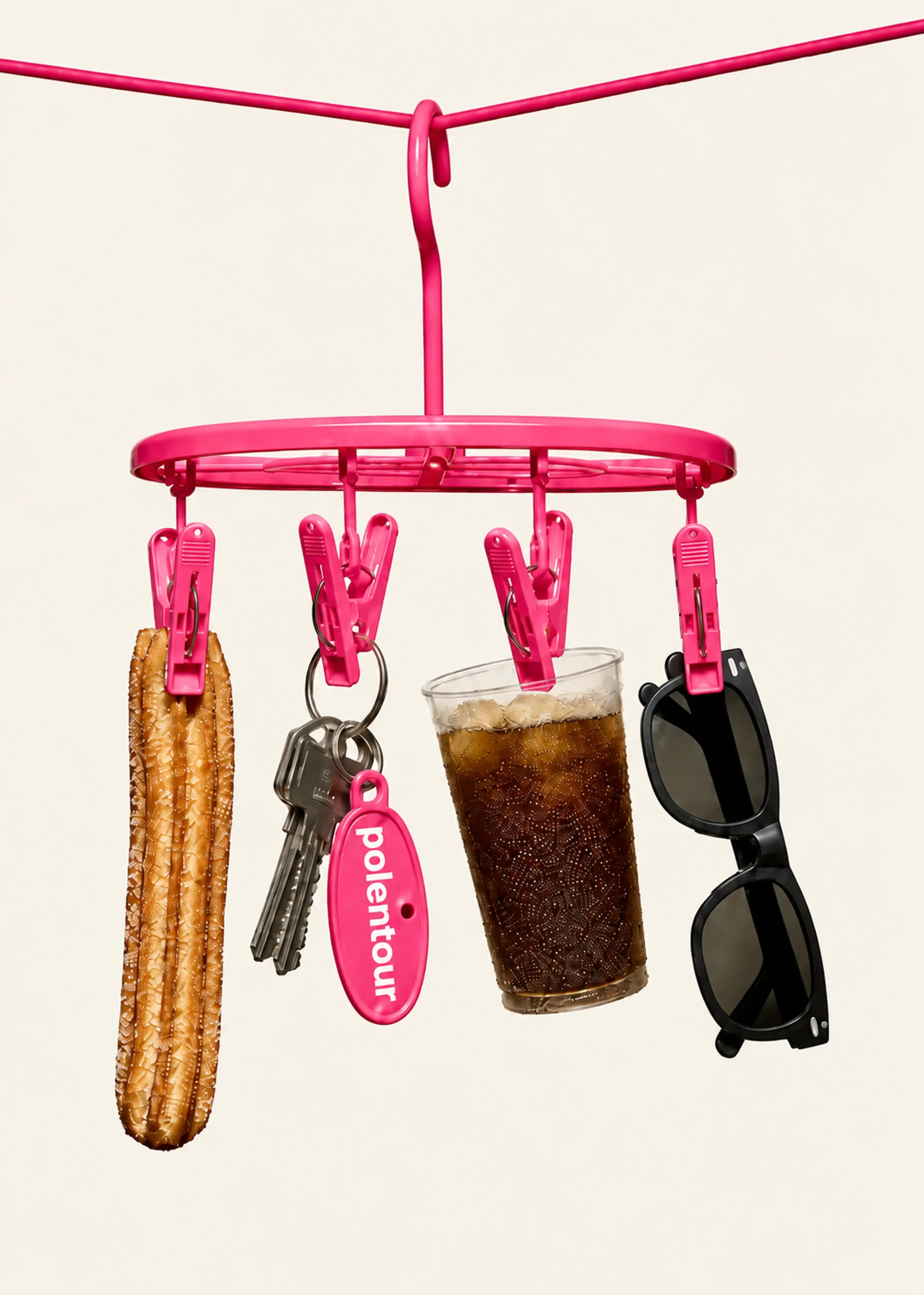 Everyday accessories hanging from a playful pink circular hanger