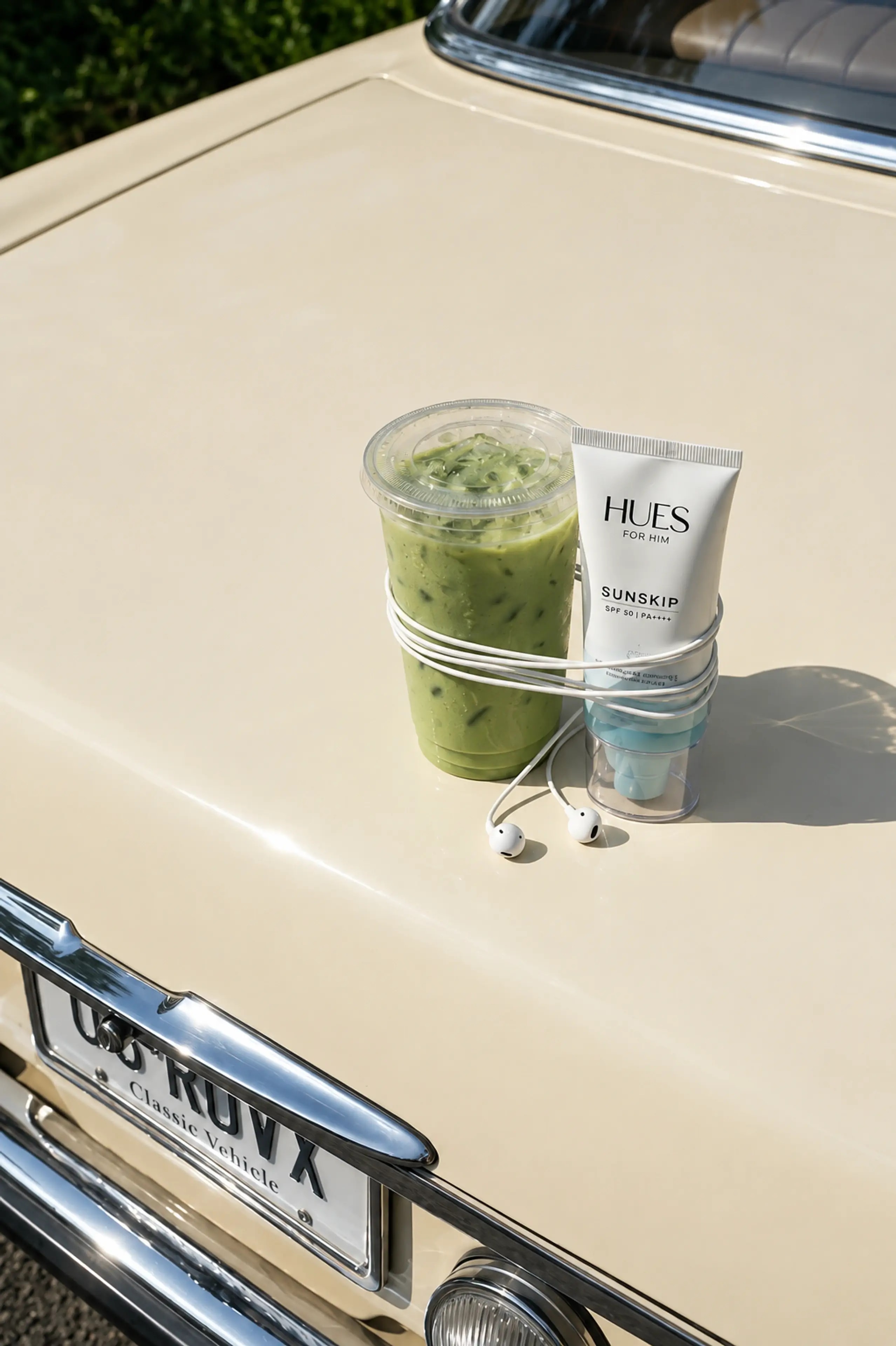 An iced matcha and water resting on a cream vintage car